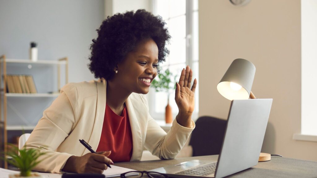 Woman engaged in a development conversation during a team call in an office setting