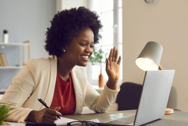 Woman engaged in a development conversation during a team call in an office setting