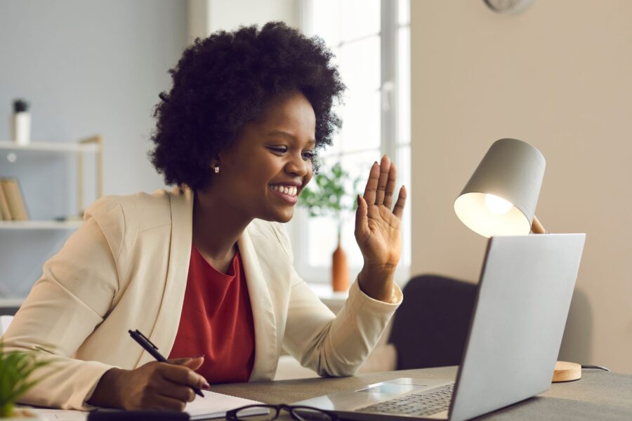 Woman engaged in a development conversation during a team call in an office setting