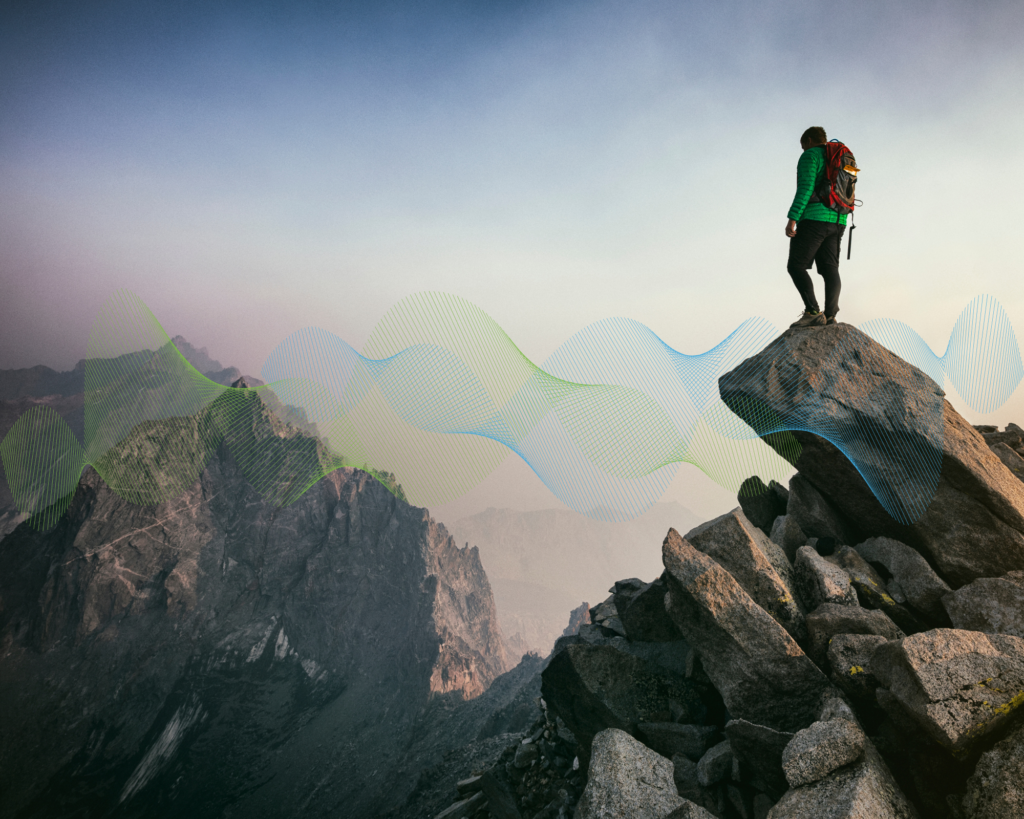 Person standing on a rocky mountain peak, looking at the horizon, with abstract blue and green wave graphics symbolizing career growth and people ecosystems.